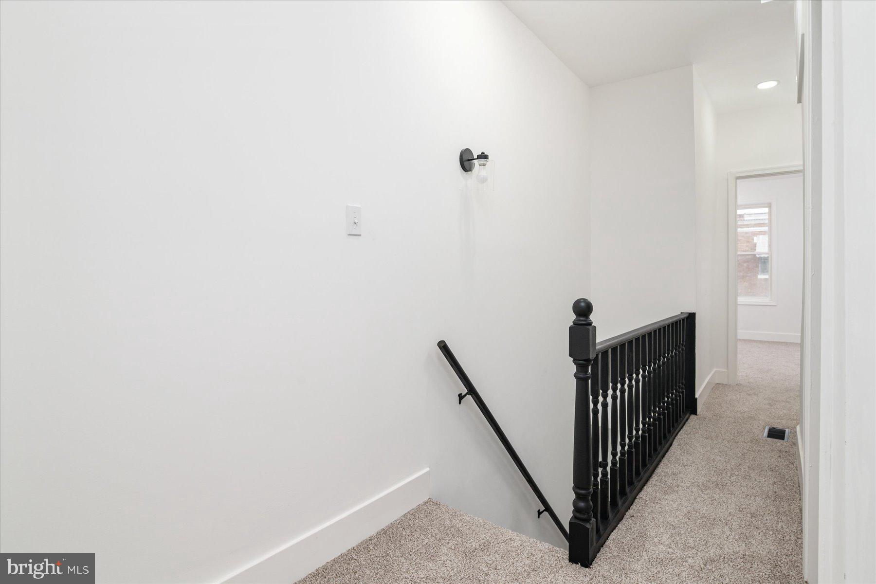 62 Gorman Avenue Baltimore, MD 21223 - Photo 13 of 24 a view of a hallway with a white door