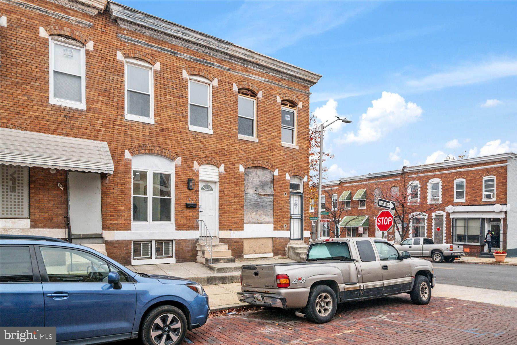 62 Gorman Avenue Baltimore, MD 21223 - Photo 2 of 24 a car parked in front of a building