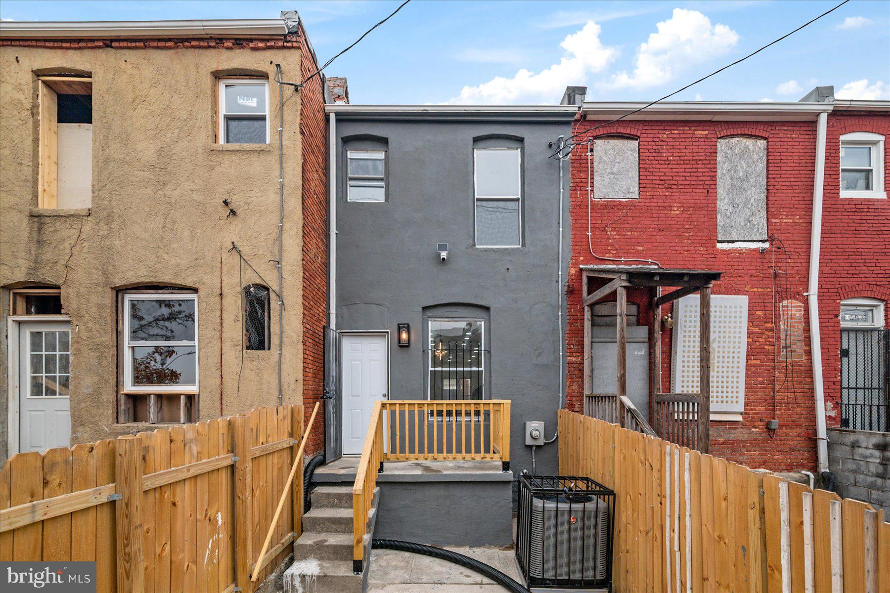 62 Gorman Avenue Baltimore, MD 21223 - Photo 24 of 24 a front view of a house with a garden