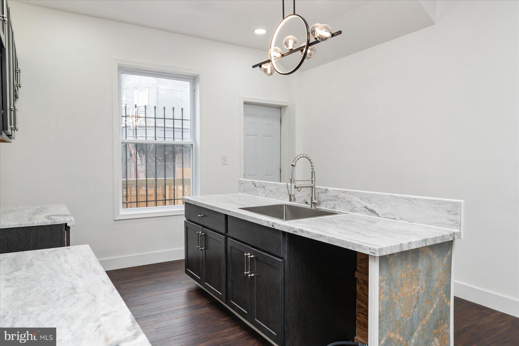 62 Gorman Avenue Baltimore, MD 21223 - Photo 9 of 24 a kitchen with a sink and a window