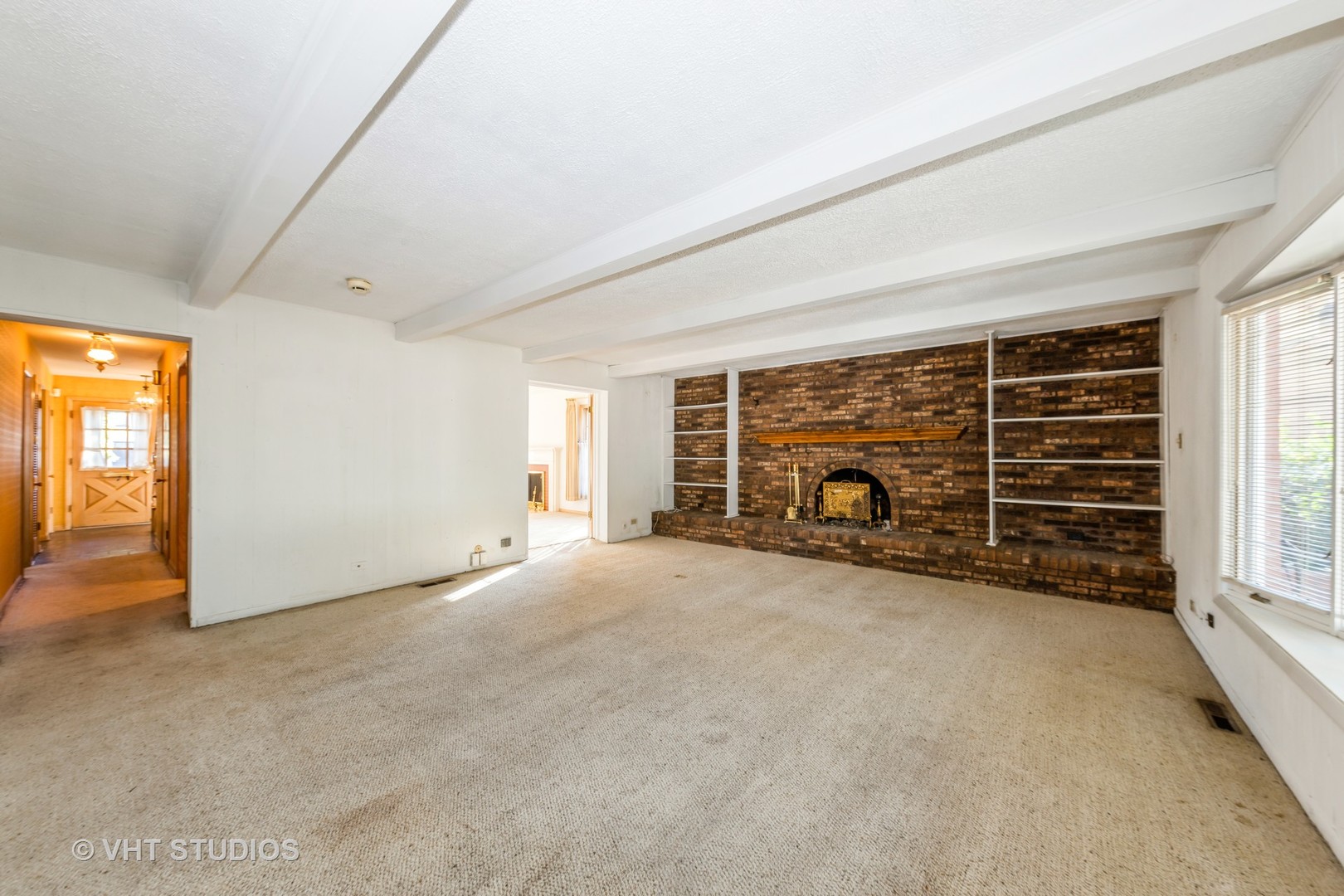 1230 Hillview Road Homewood, IL 60430 - Photo 5 of 13 a view of an empty room with a fireplace and a window