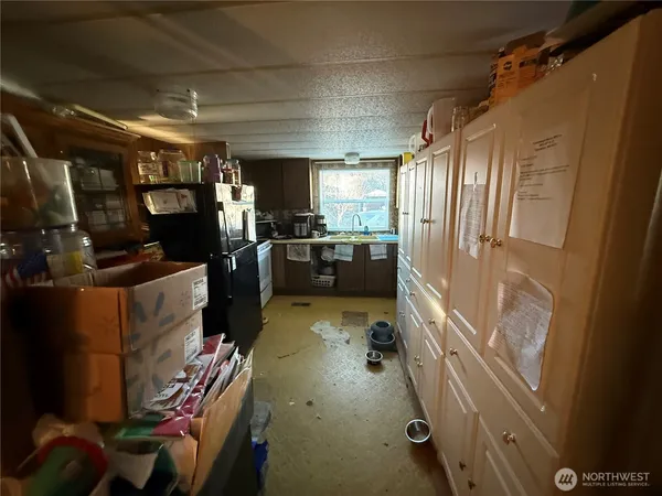 a bed room with furniture and a flat screen tv