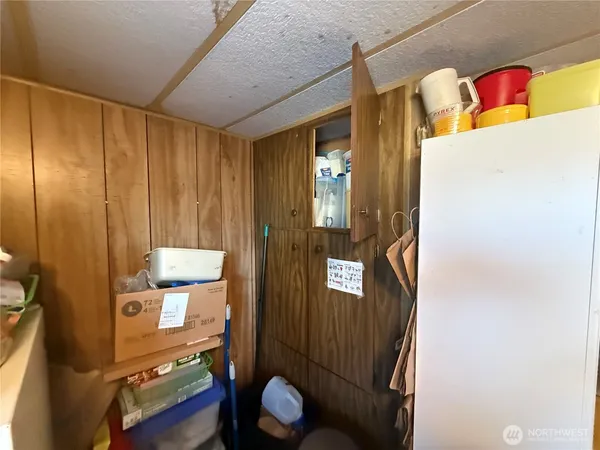 a kitchen with stainless steel appliances granite countertop a refrigerator and a stove