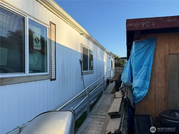 a view of walk in closet with clothes