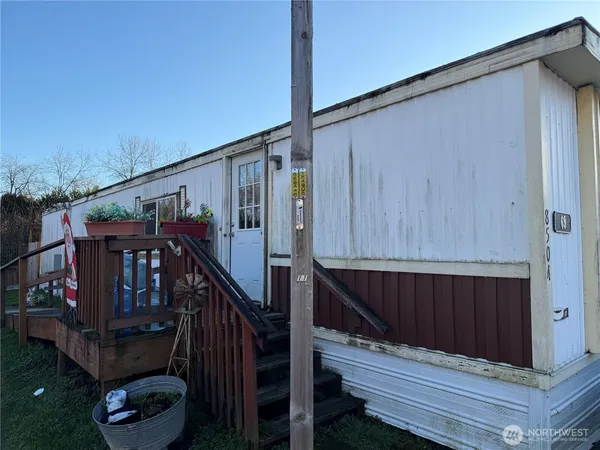 a kitchen with stove and cabinets