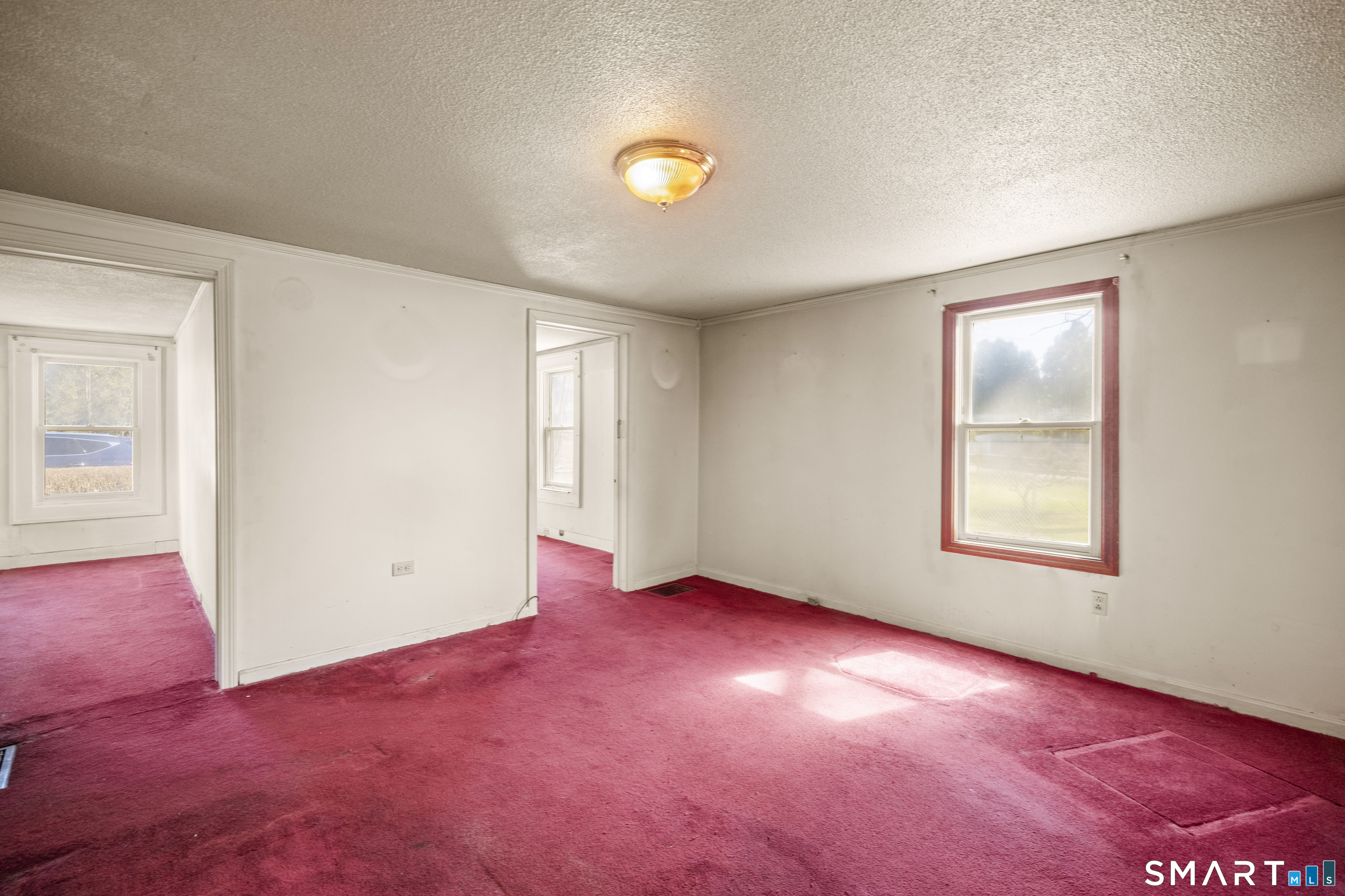 56 South River Street Enfield, CT 06082 - Photo 19 of 38 an empty room with windows and closet