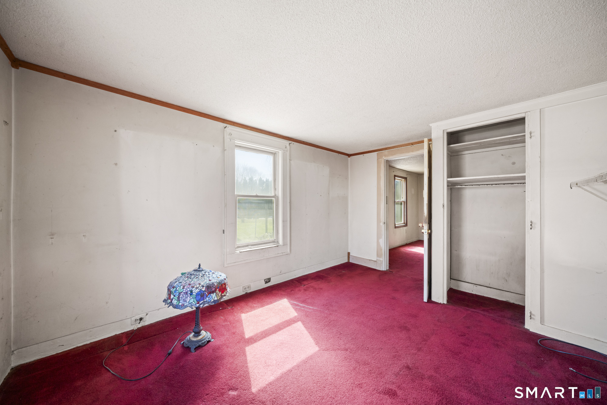 56 South River Street Enfield, CT 06082 - Photo 20 of 38 an empty room with windows and closet