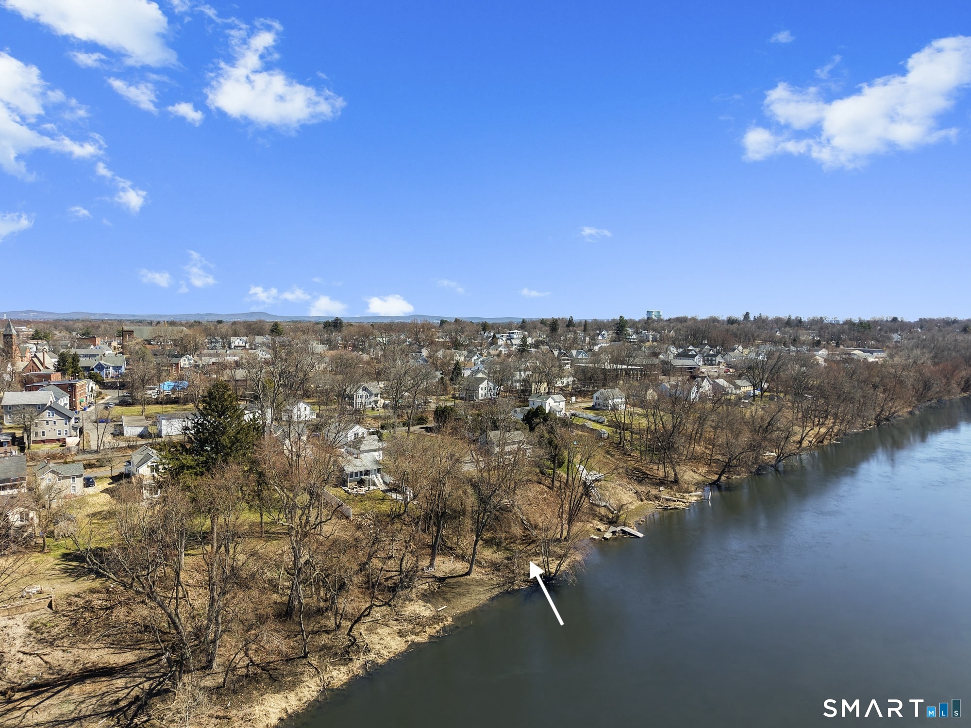 56 South River Street Enfield, CT 06082 - Photo 2 of 38 a view of a lake with houses