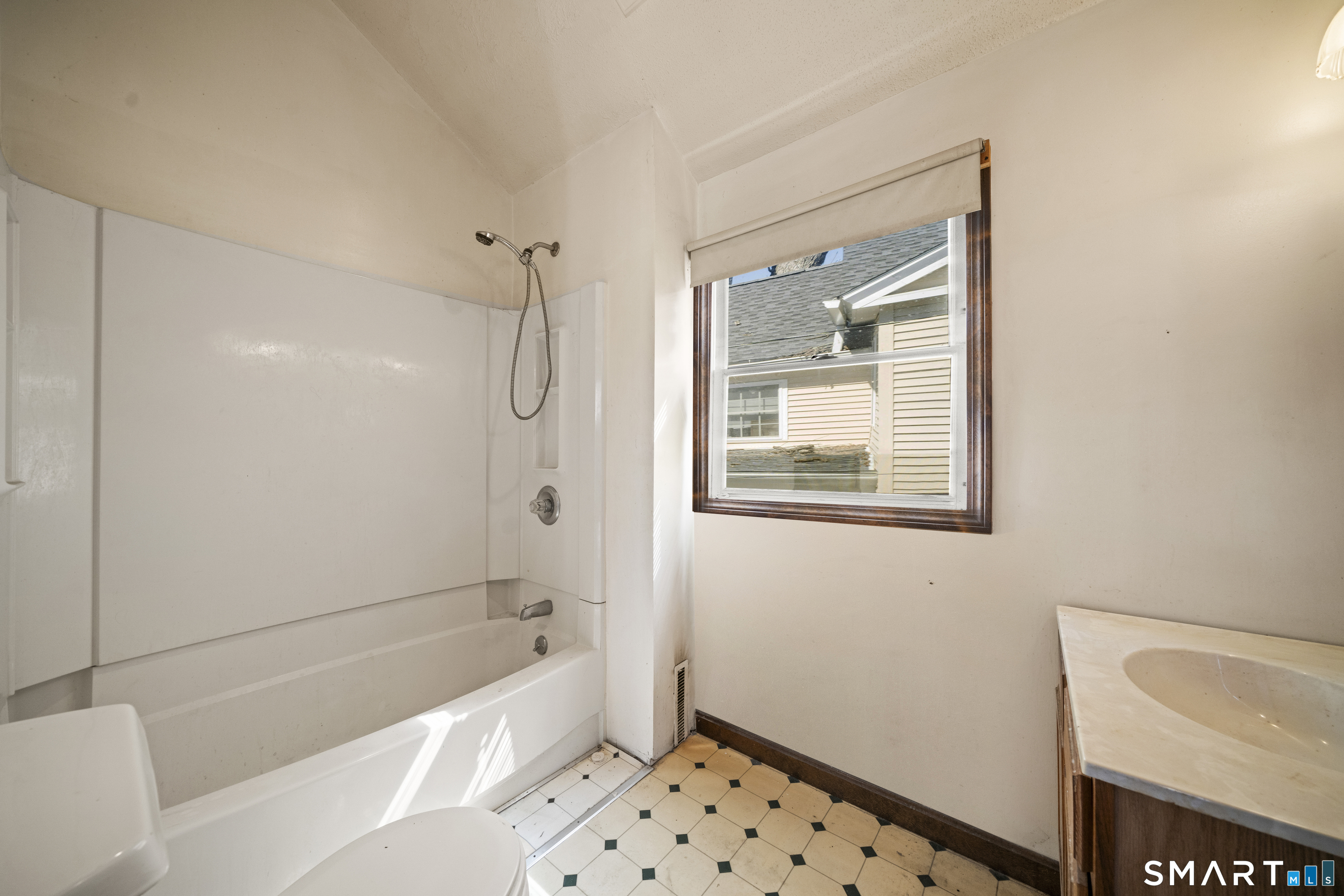 56 South River Street Enfield, CT 06082 - Photo 30 of 38 a bathroom with a bathtub and a shower