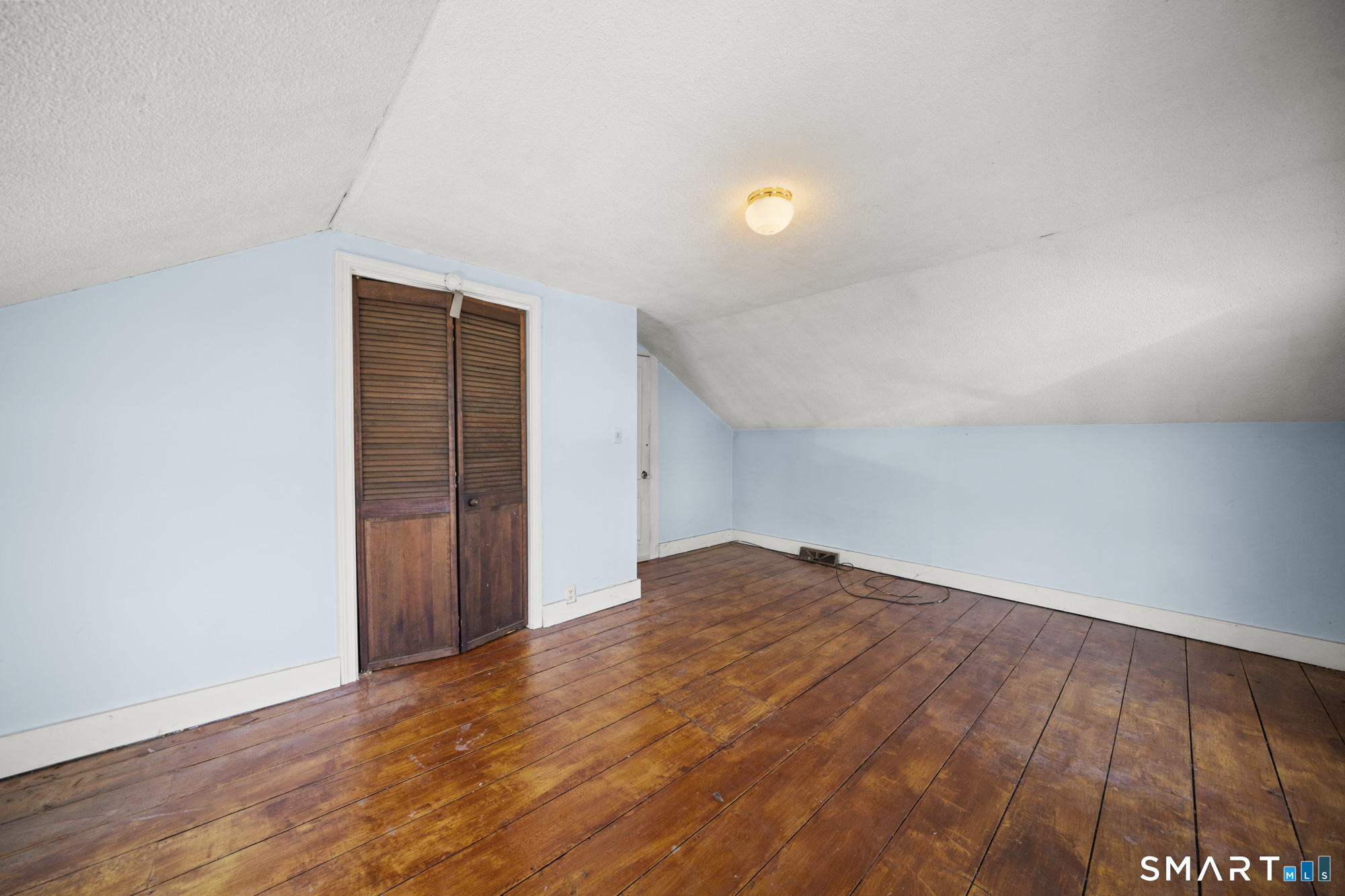 56 South River Street Enfield, CT 06082 - Photo 35 of 38 a view of empty room with wooden floor