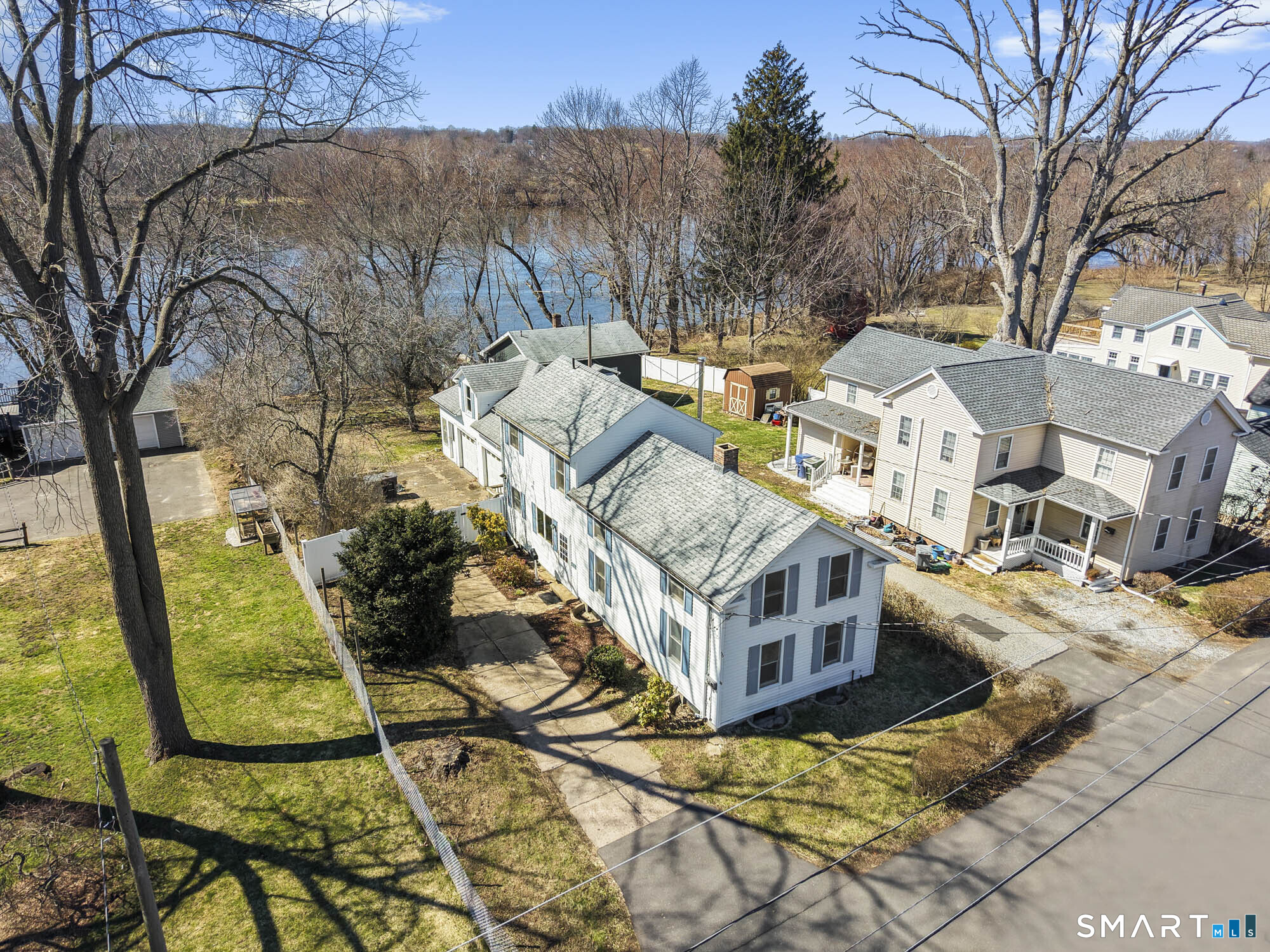 56 South River Street Enfield, CT 06082 - Photo 5 of 38 a view of a house with backyard and trees