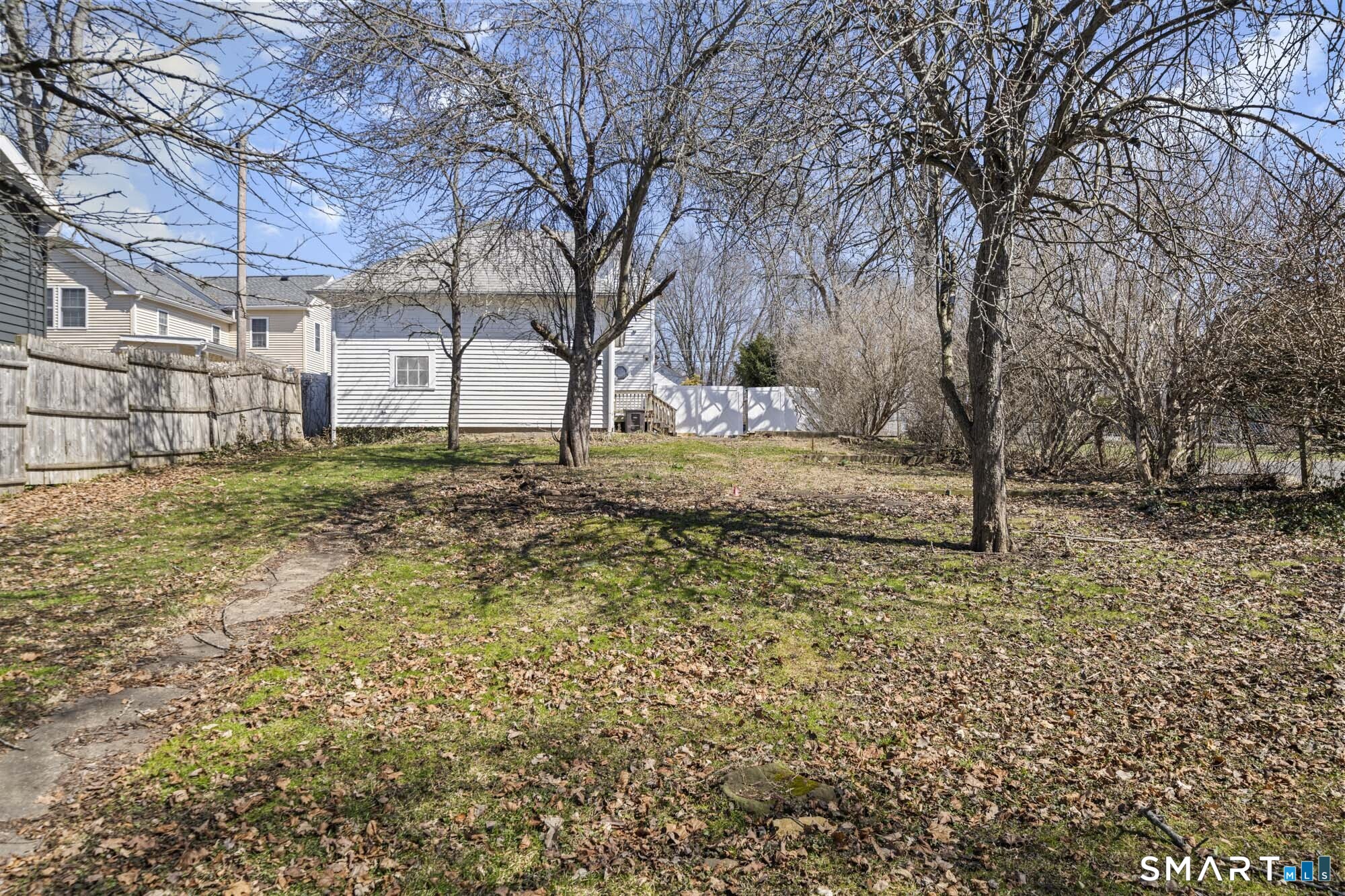 56 South River Street Enfield, CT 06082 - Photo 9 of 38 a view of a yard with large trees