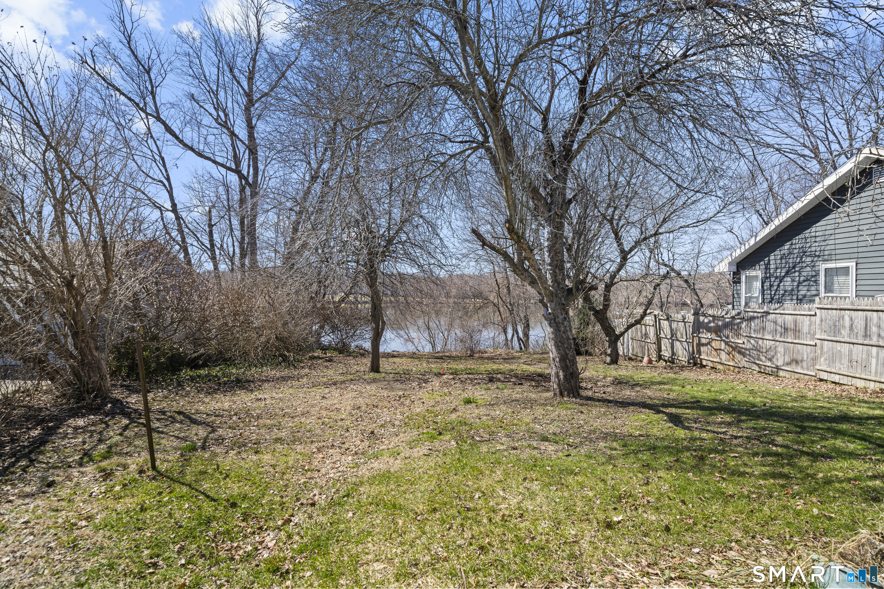 56 South River Street Enfield, CT 06082 - Photo 10 of 38 a white house covered with snow in front of house