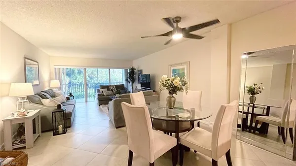 a dining room with furniture and window