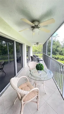 a view of a patio with a dining table and chairs