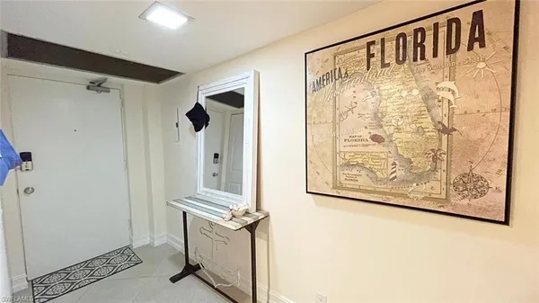 a view of front door with wooden floor