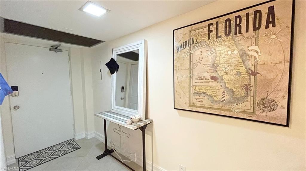 1 Bluebill Avenue, Unit 210 Naples, FL 34108 - Photo 10 of 17 a view of front door with wooden floor