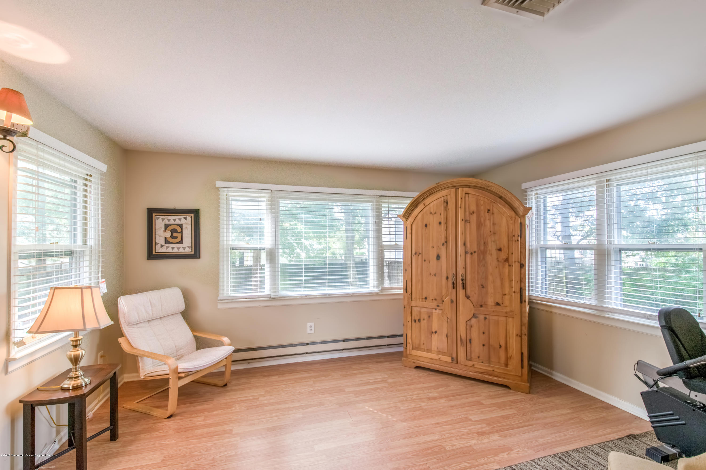 156 Captain Road Manahawkin, NJ 08050 - Photo 16 of 39 a living room with furniture and a window