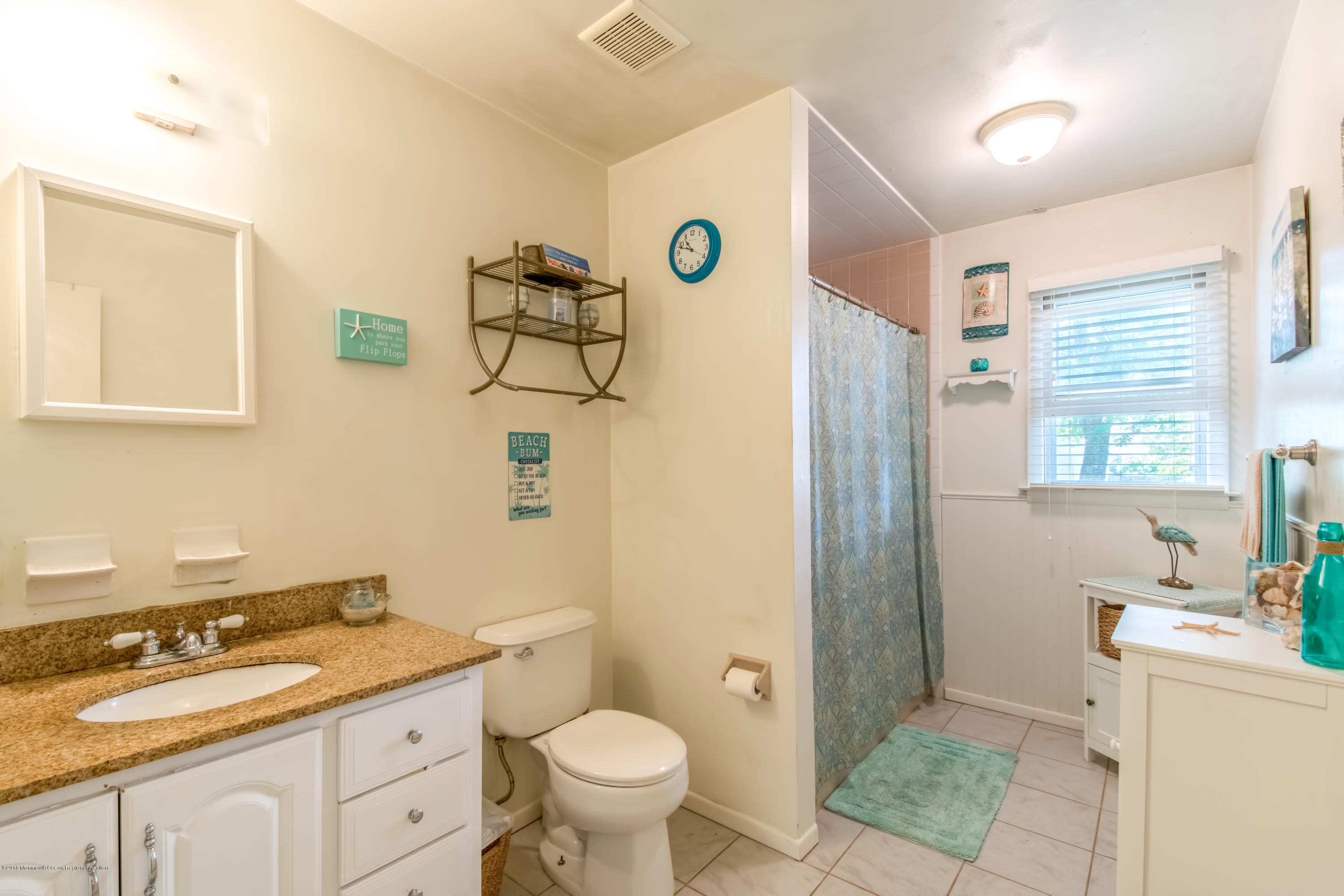 156 Captain Road Manahawkin, NJ 08050 - Photo 26 of 39 a bathroom with a granite countertop sink toilet and shower