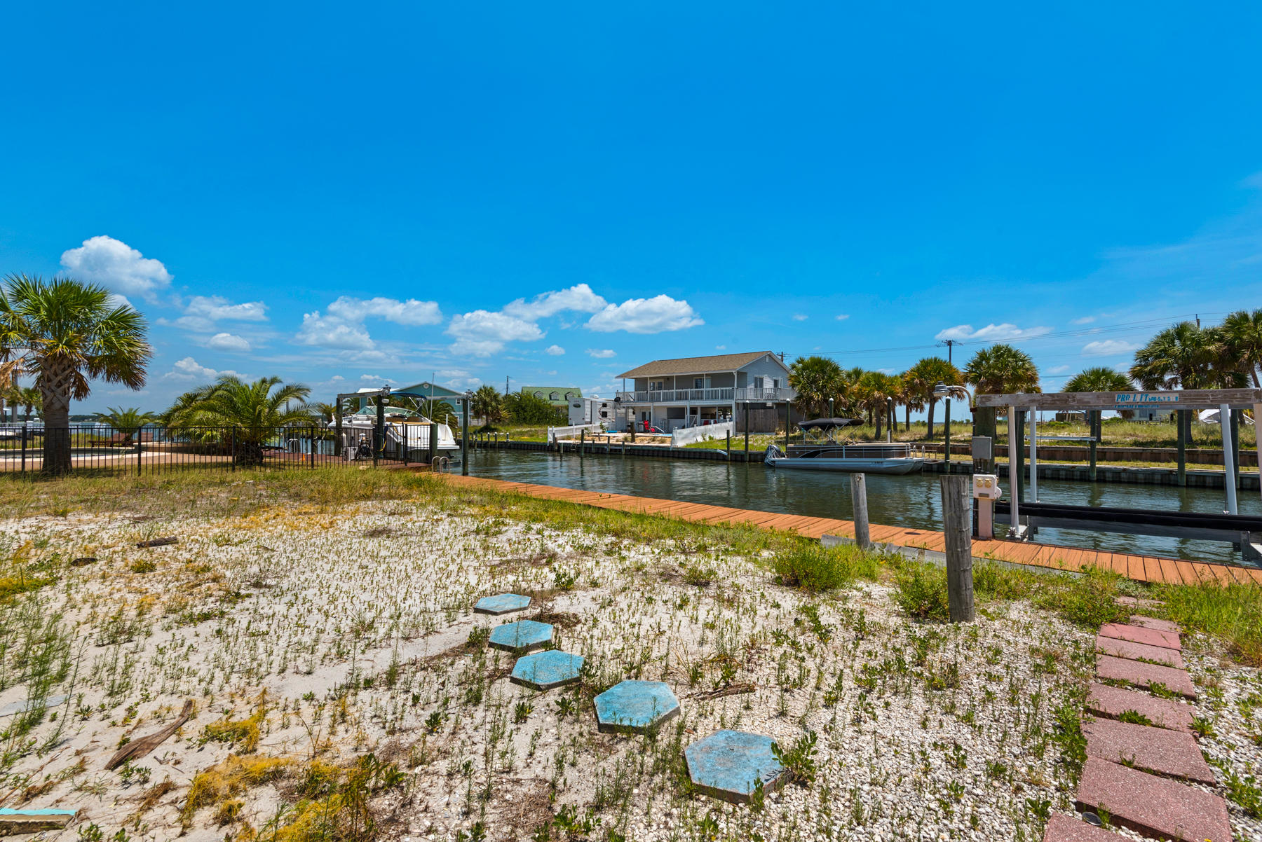 1468 Alabama Street Navarre, FL 32566 - Photo 6 of 9 a view of a lake with a house