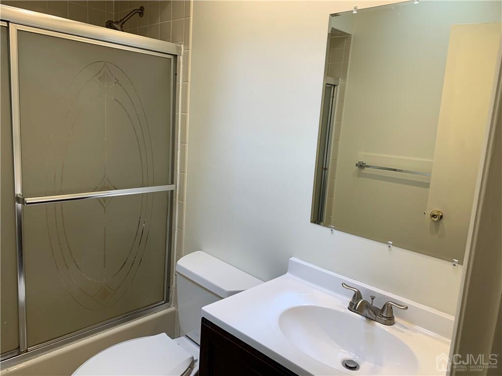 4702 Stonehedge Road Edison, NJ 08820 - Photo 12 of 24 a bathroom with a sink toilet and shower