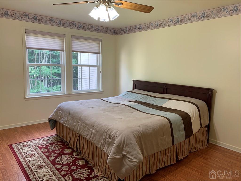 4702 Stonehedge Road Edison, NJ 08820 - Photo 13 of 24 a bedroom with a bed and a window