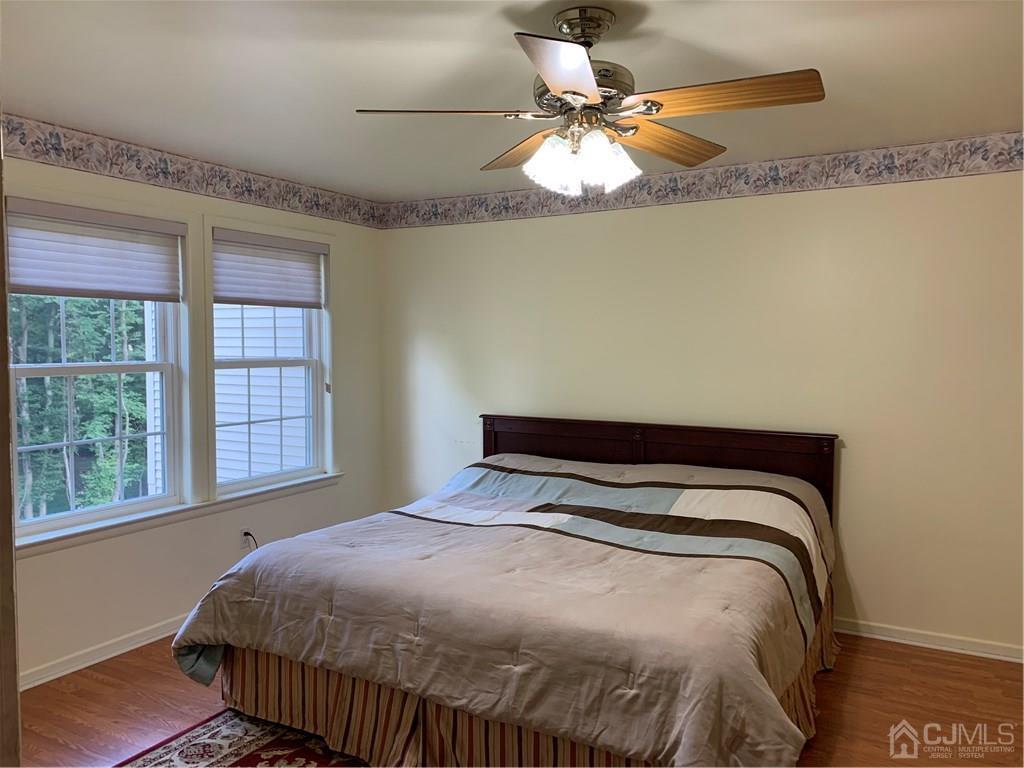 4702 Stonehedge Road Edison, NJ 08820 - Photo 14 of 24 a bedroom with a bed and a window