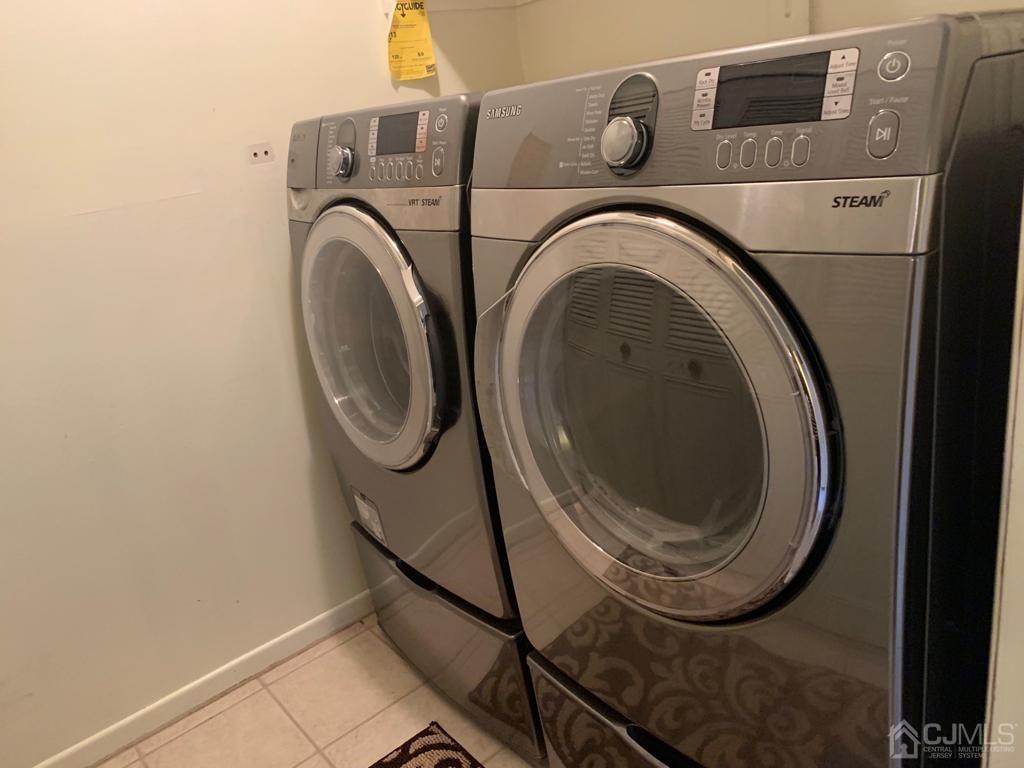 4702 Stonehedge Road Edison, NJ 08820 - Photo 23 of 24 a utility room with dryer and washer