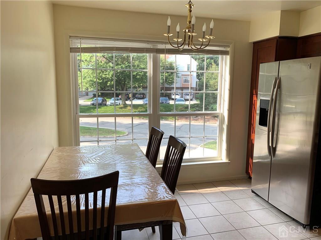 4702 Stonehedge Road Edison, NJ 08820 - Photo 4 of 24 a view of a dining room with furniture window and outside view