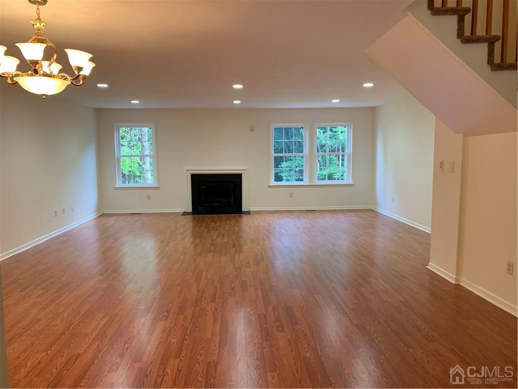 4702 Stonehedge Road Edison, NJ 08820 - Photo 6 of 24 a view of room with window and wooden floor