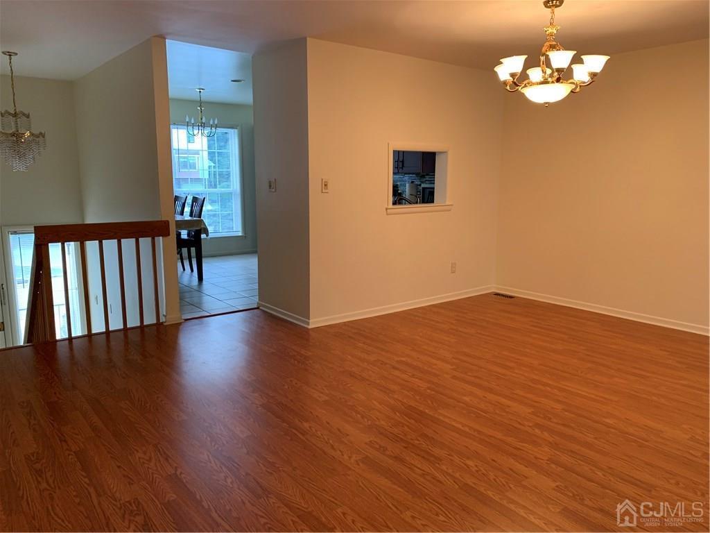 4702 Stonehedge Road Edison, NJ 08820 - Photo 8 of 24 a view of a livingroom with wooden floor