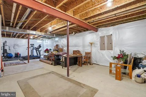 a bedroom with a bed and lamp