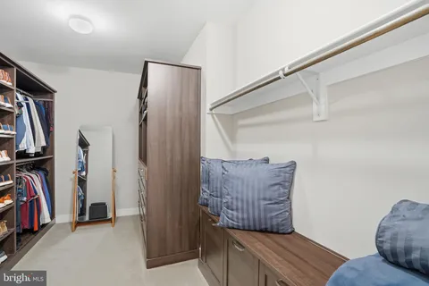 a bathroom with double vanity sinks and a mirror