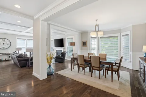 a dining room with furniture window wooden floor