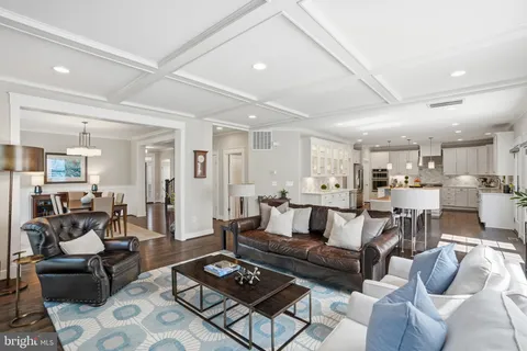 a living room with furniture fireplace and window