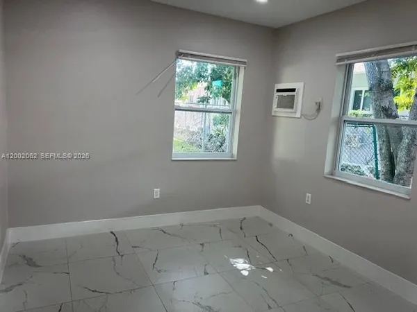 an empty room with windows