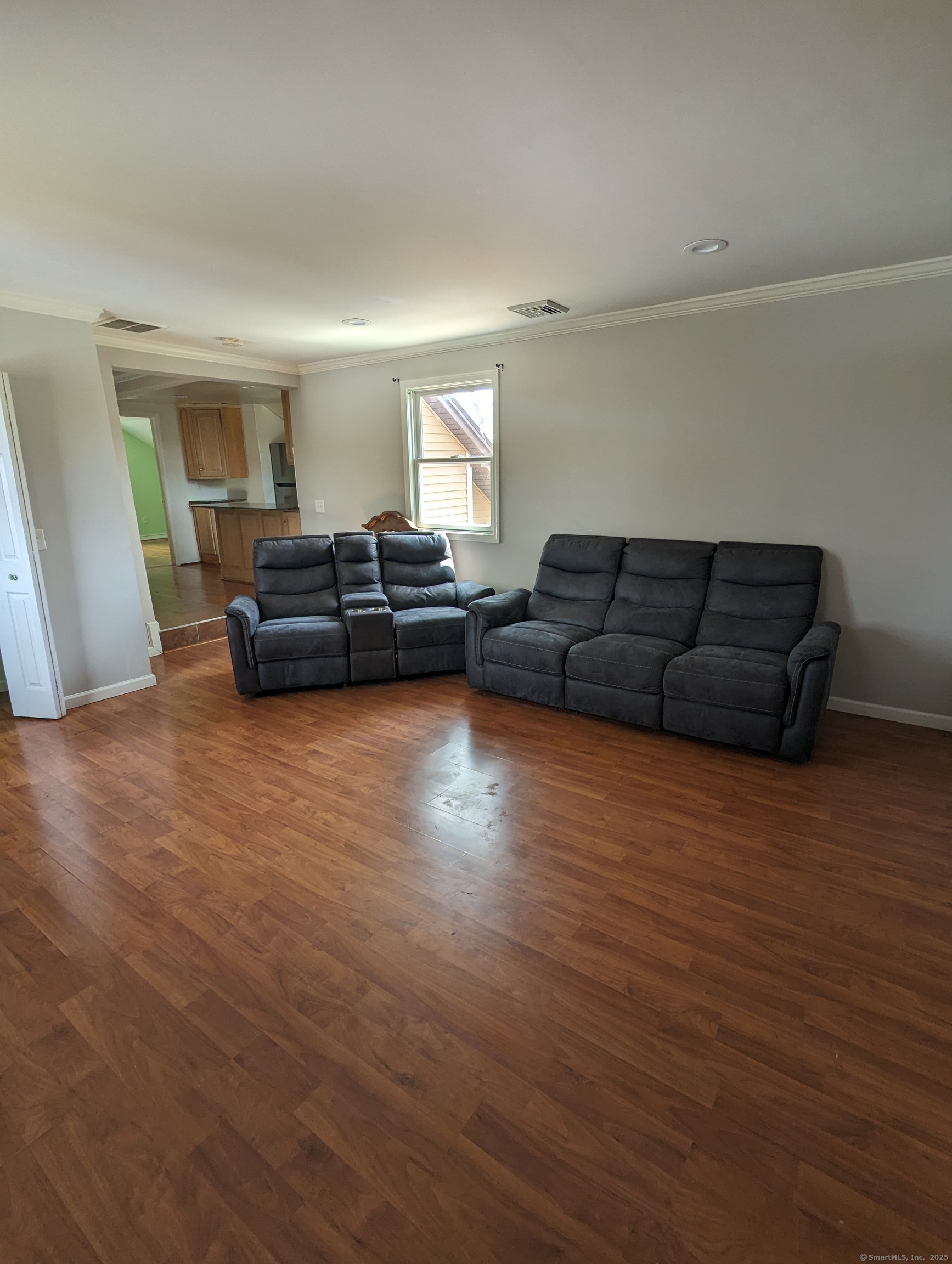 99 River Road, Unit 2 Windsor Locks, CT 06096 - Photo 5 of 6 a living room with furniture and a wooden floor