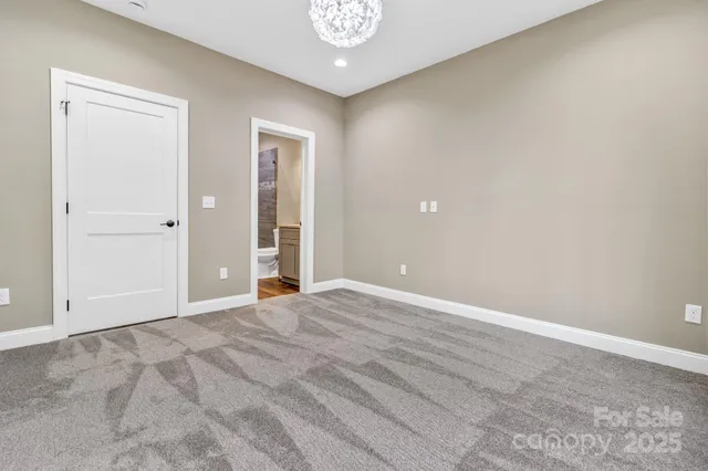 a spacious bathroom with double vanity sink a two mirror a window a bathtub and vanity