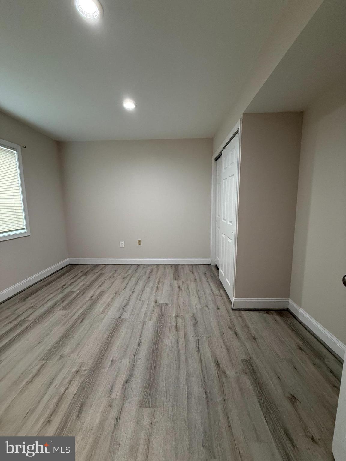 3801 Tremayne Terrace Silver Spring, MD 20906 - Photo 22 of 25 an empty room with wooden floor and windows