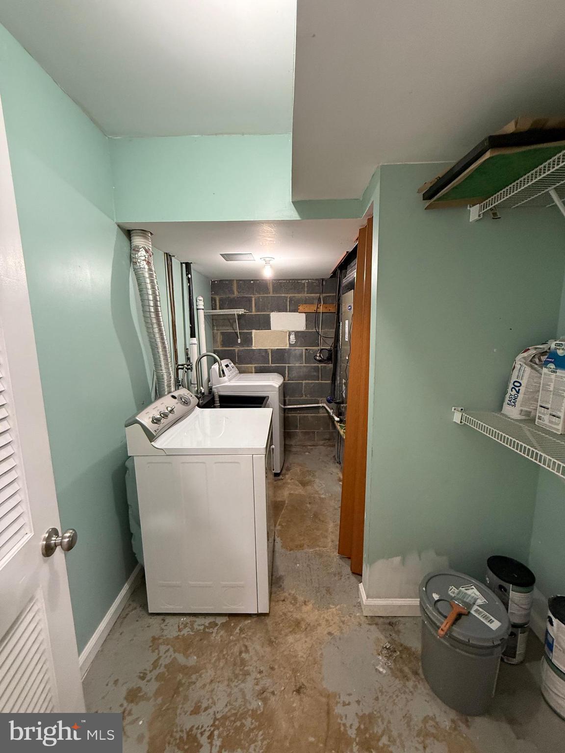 3801 Tremayne Terrace Silver Spring, MD 20906 - Photo 23 of 25 a room with a washing machine and storage