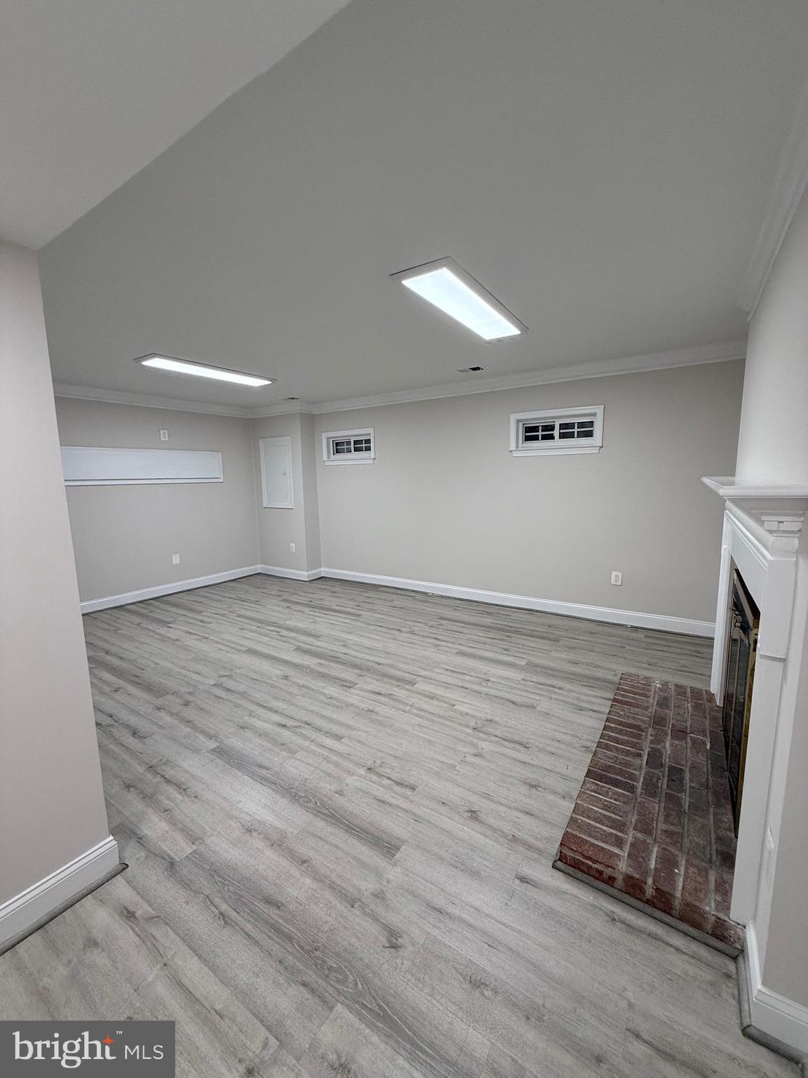 3801 Tremayne Terrace Silver Spring, MD 20906 - Photo 24 of 25 a view of an empty room with wooden floor and a fireplace