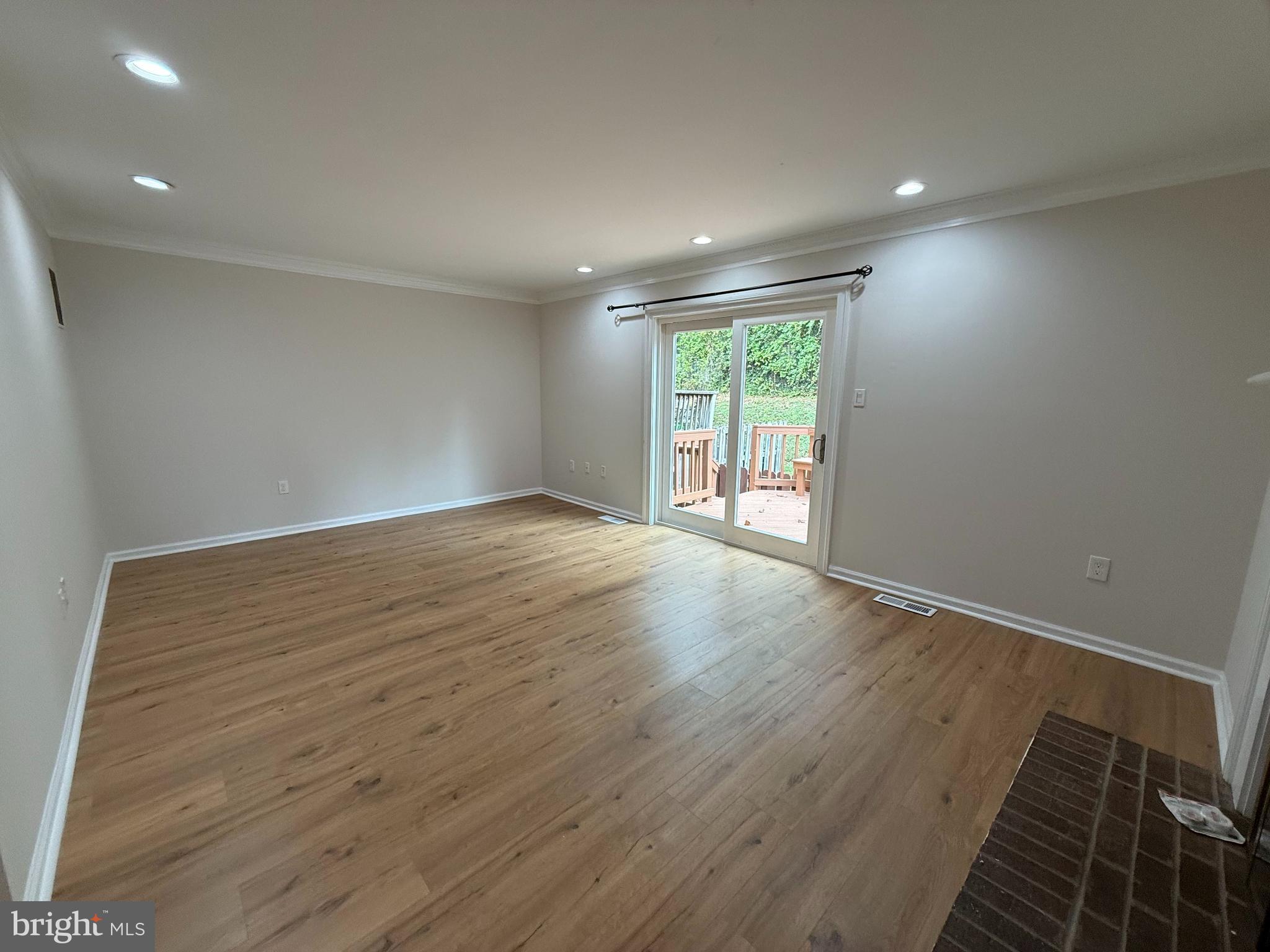 3801 Tremayne Terrace Silver Spring, MD 20906 - Photo 7 of 25 an empty room with wooden floor and windows