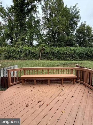 a view of a wooden deck with a bench