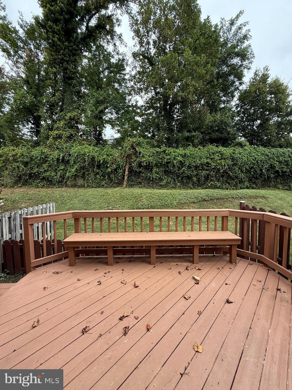 3801 Tremayne Terrace Silver Spring, MD 20906 - Photo 10 of 25 a view of a wooden deck with a bench