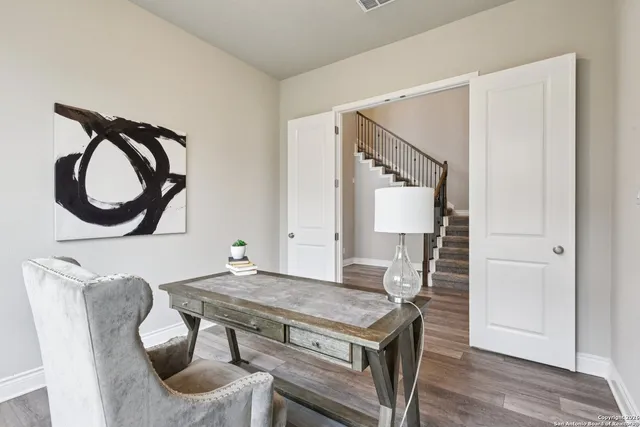 a view of a dining room with furniture and window