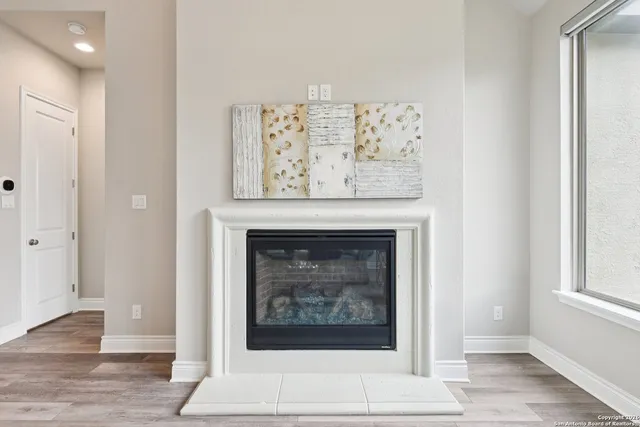 a dining room with furniture and wooden floor