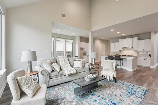 a dining room with furniture and window