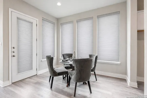 a bedroom with a bed and a ceiling fan
