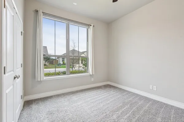 a view of a workspace with a table and chair