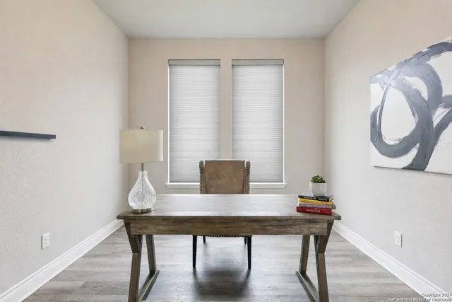 a view of a workspace with furniture